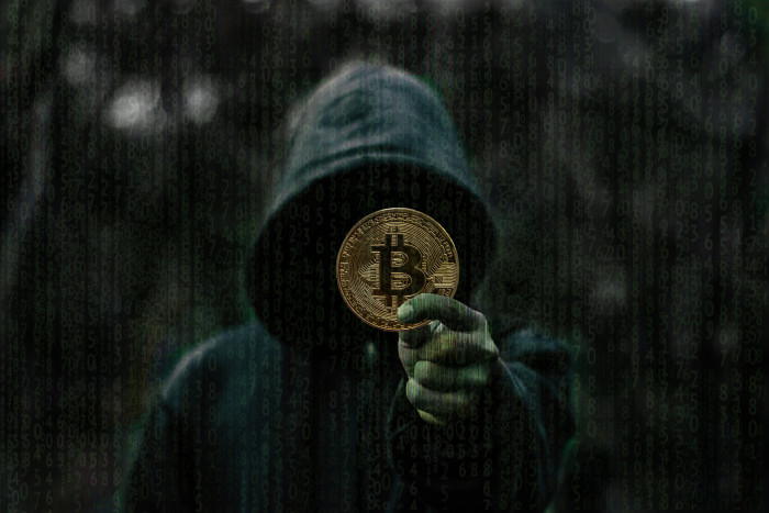 person showing round gold colored Bitcoin coin dark blockchain 49 2k 4k 5k