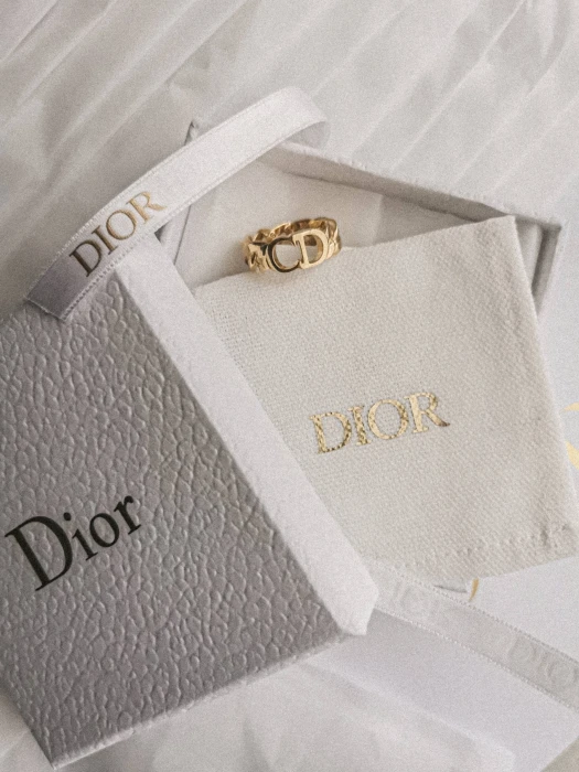 dior gold ring and gift box actress hollywood 2k