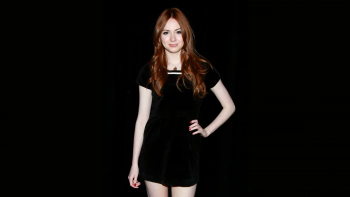 Karen Gillan redhead actress hands on hips black background 2k