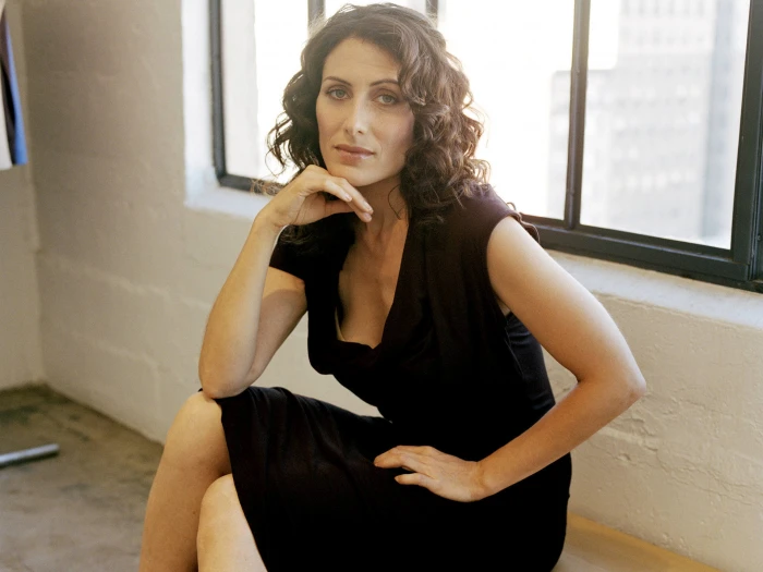 Lisa Edelstein mature women black dress curly hair sitting