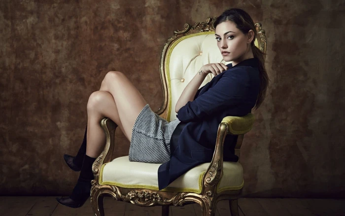 tufted white leather padded wooden armchair Phoebe Tonkin women