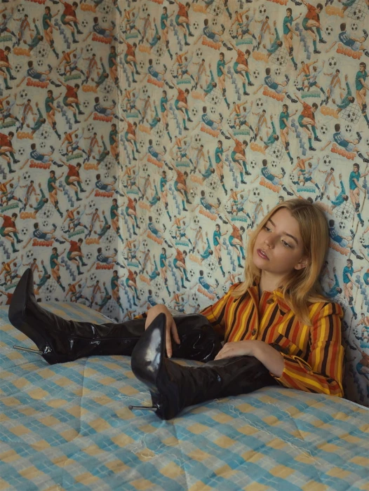 women actress knee high boots Anya Taylor Joy indoors