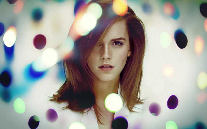 women's white button up top Emma Watson with bokeh lights actress