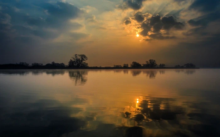 body of water nature landscape calm clouds sunset lake
