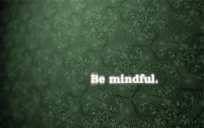Be mindful text with green background abstract motivational