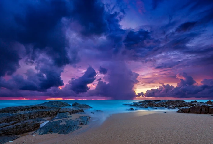 brown sand beach with blue sky and cloud photo thailand
