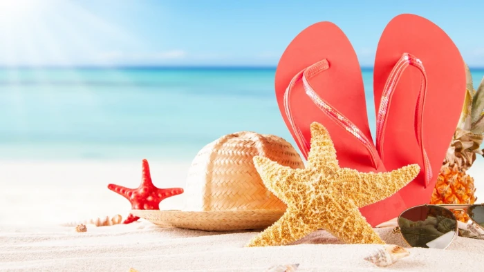 Sea sand beach women's pink rubber flipflops with aviator sunglasses and woven sun hat