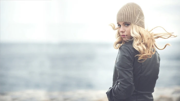 woman wearing jacket standing beside beach women blonde blue eyes 2k