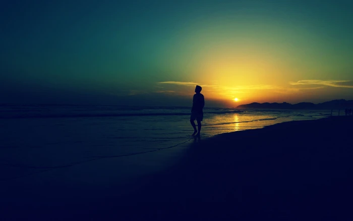 Sad Alone Man At Sunset Beach Waves photography of man walking on beach 2k