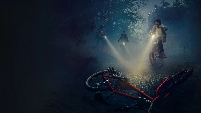 three people looking at red bicycle on ground digital wallpaper 2k