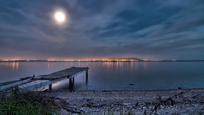 white wooden seashore port night lights beach Moon sky water 2k