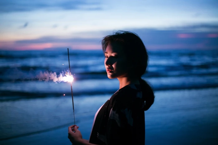 women outdoors Asian beach fireworks 2k