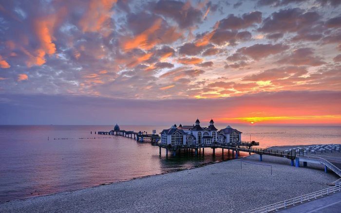 white house on dock water clouds beach landscape sea sunlight 2k