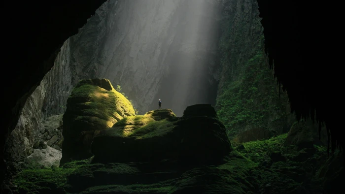 green mossy cave nature trees men rock sunlight object 2k
