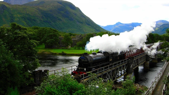 black steam locomotive train nature landscape trees Scotland 2k