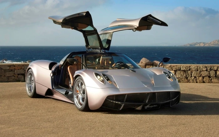 white and black sports car Pagani Huayra mode of transportation 2k