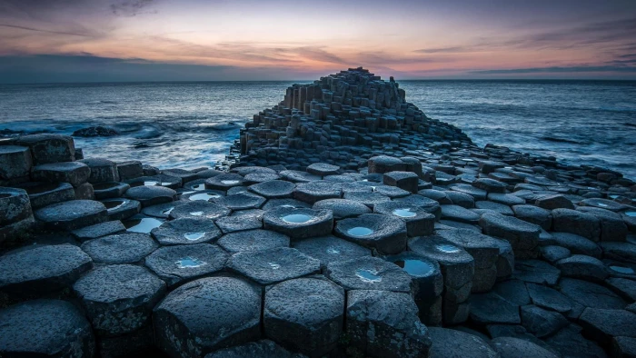 stone near water at night nature landscape horizon rock formation 2k