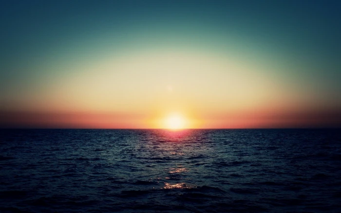 calm body of water sunset sea sunlight sky nature summer 2k
