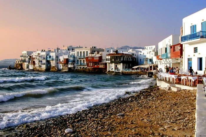 houses near sea mykonos water beach wave travel sky blue 2k