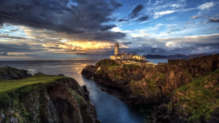 white lighthouse nature landscape clouds rock Ireland cliff 2k