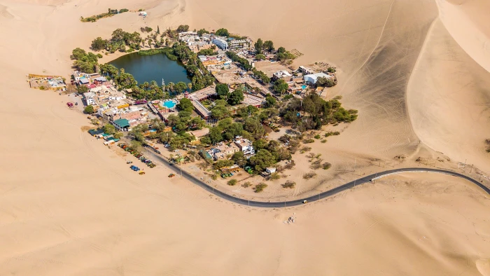 bird's eye photography of village sand desert lake aerial view 2k