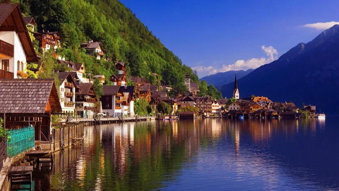 reflection nature mountain village water lake sky town 2k