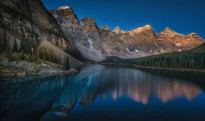 body of water near trees mountains Moraine Lake Canada sunset 2k