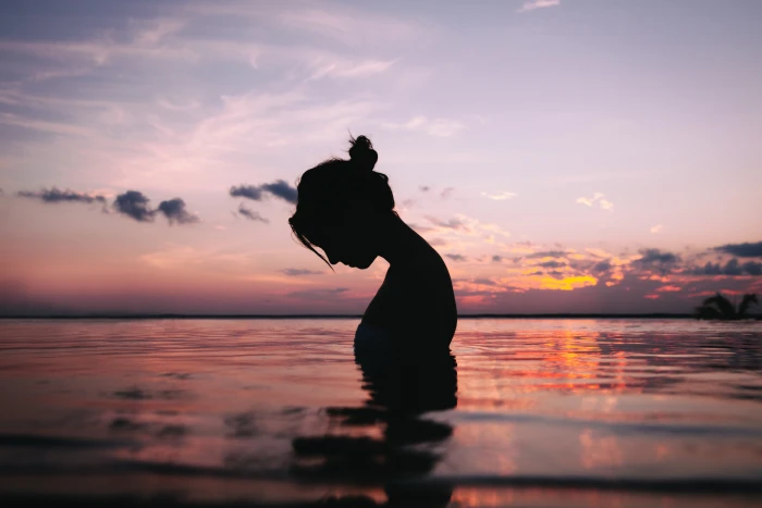 silhouette of a woman in body water during sunset mike monaghan 2k