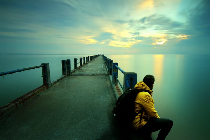 thinking sitting beach sunset watching ocean guy man 2k