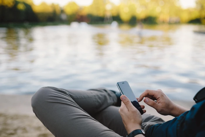 Young Man Using His Phone on beach people summer tech technology 2k 4k