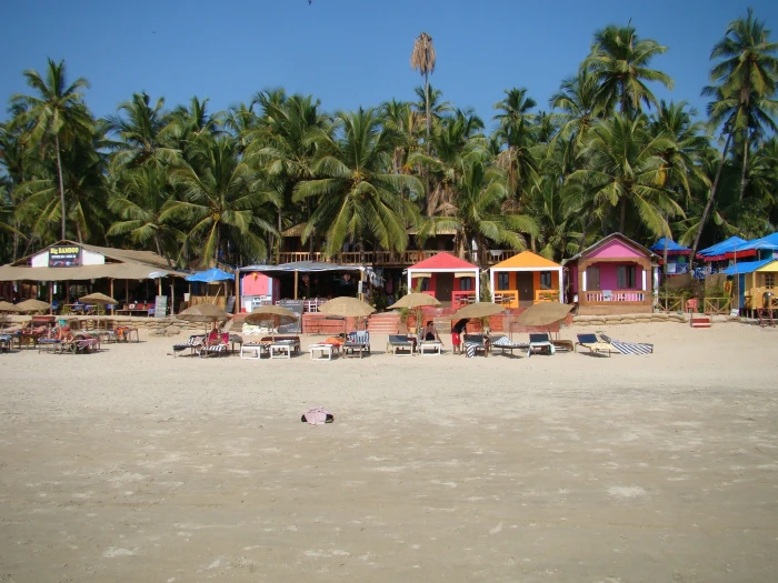 brown umbrellas near house during daytime Sand Goa Shack India 2k