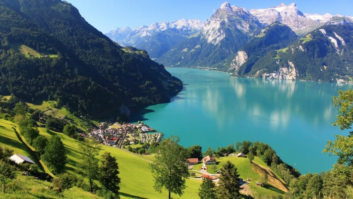 houses near lake between mountains landscape lucerne nature 2k