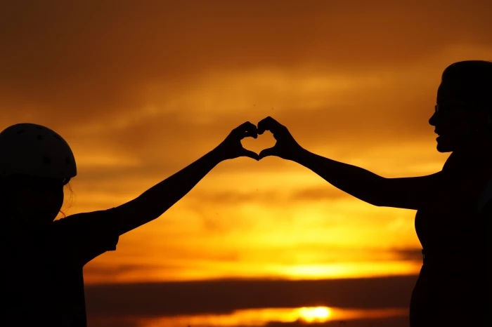 Silhouette of Man Touching Woman Against Sunset Sky art backlit 2k 4k 5k