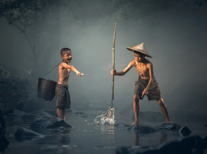 Boy Catching Fish with a Spear boy s black shorts Asia Thailand 2k 4k
