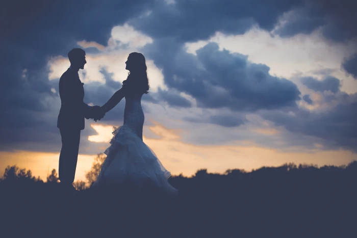 silhouette of wedding couple during sunset man and woman standing 2k 4k 5k