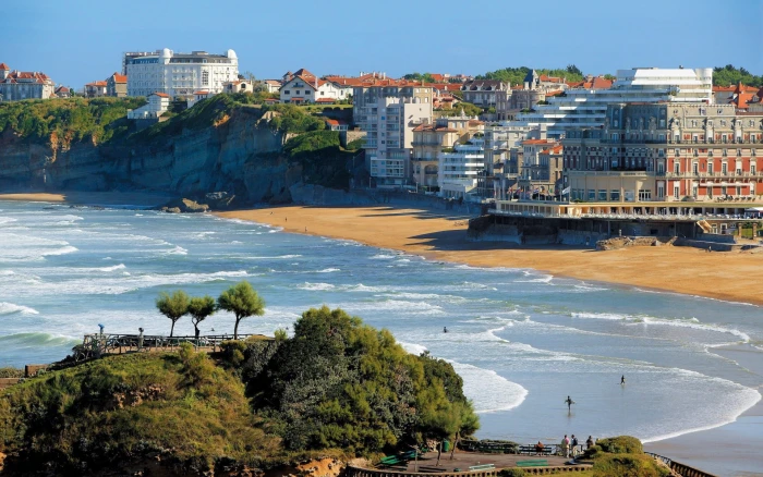 concrete building near body of water landscape coast Spain 2k