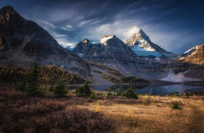 gray rock mountain near body of water under sky 2k