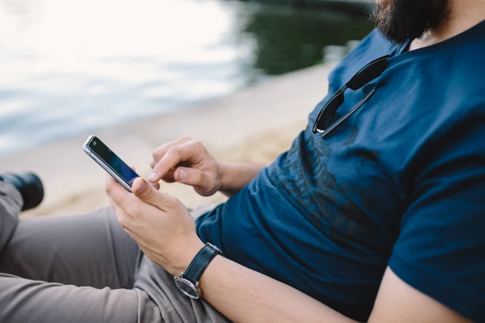 Young Man Using His Phone on beach people summer tech technology 2k 4k