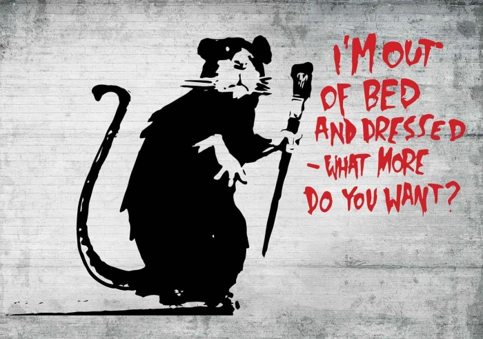 Banksy graffiti concrete street art western script text