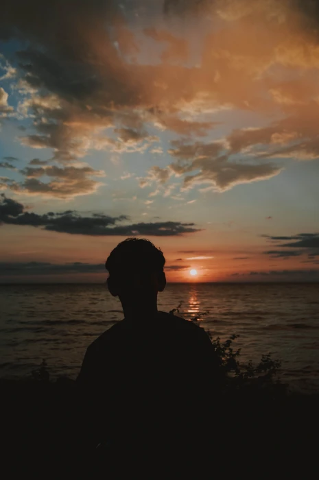 Silhouette Photography of Man Near Body Water alone backlit 2k 4k