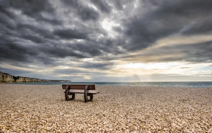 Sea beach stones bench clouds 2k