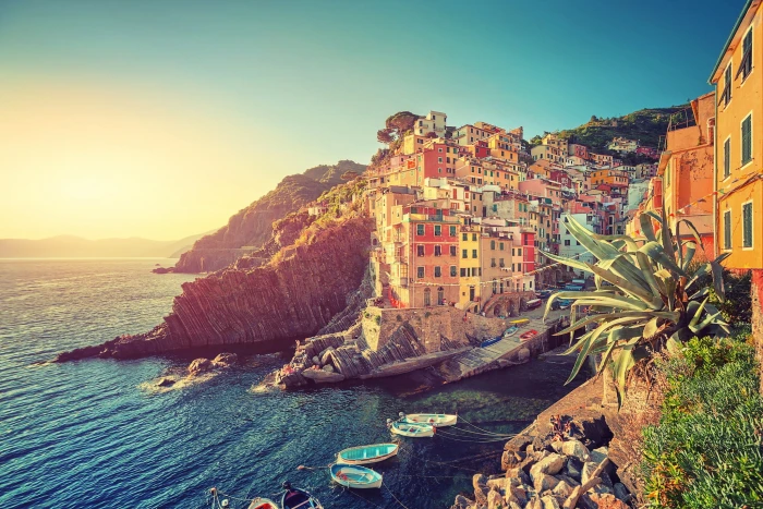 multicolored buildings wallpaper brown and near body of water at daytime 2k