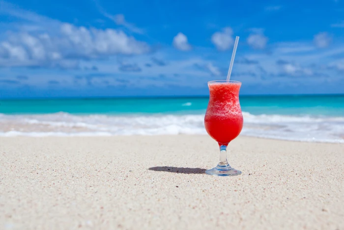 Red Slush Drink in Glass on Beach beverage cocktail drinking glass 2k 4k