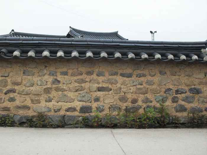 brown and black concrete house at daytime hanok republic of korea 2k