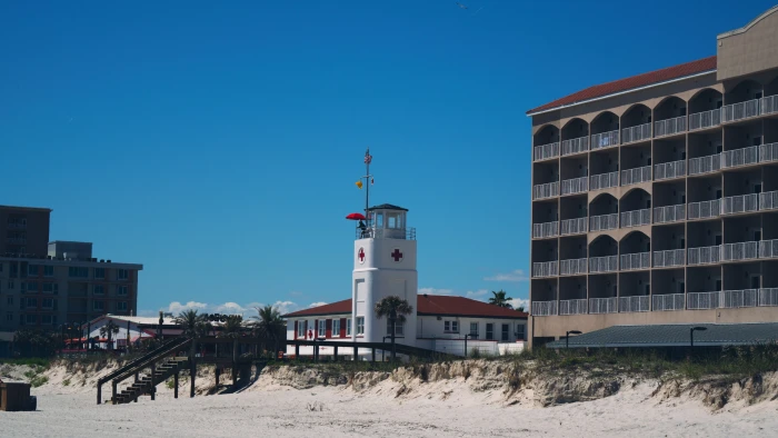 white and brown concrete building beach exterior sky 2k 4k
