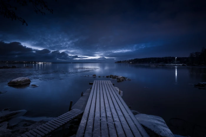 brown wooden dock under black sky during night time Snowy nikon d 2k 4k 5k