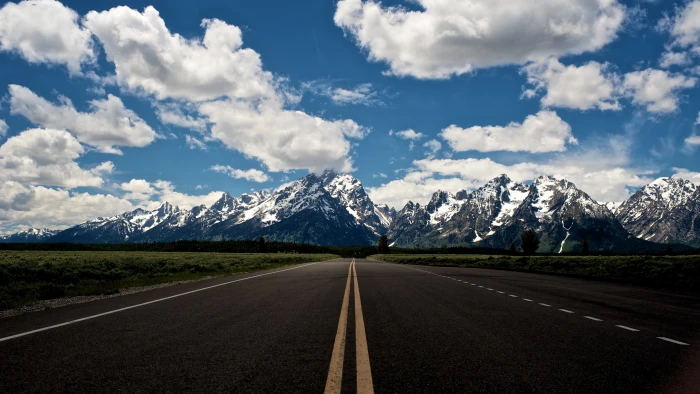 gray concrete road and snow covered mountain landscape nature 2k 4k