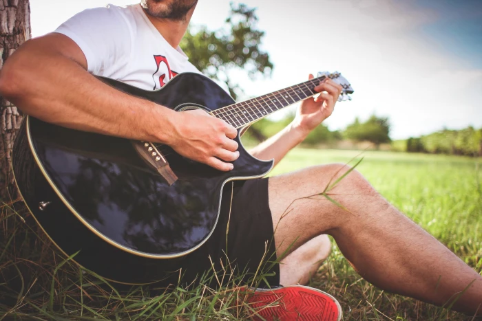 Guy Playing Acoustic Guitar in Nature boy gardens grass man 2k 4k