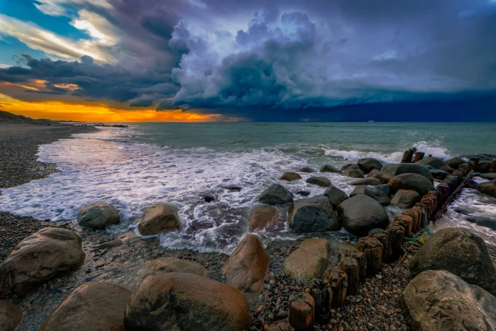 photography of rocky sea bay during cloudy day Gammel Skagen 2k