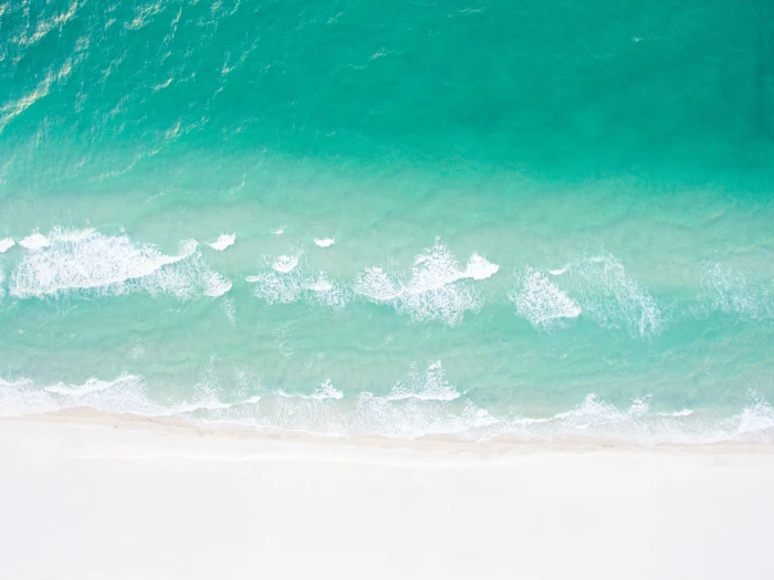 aerial photography of sea waves top view seashore daytime 2k 4k